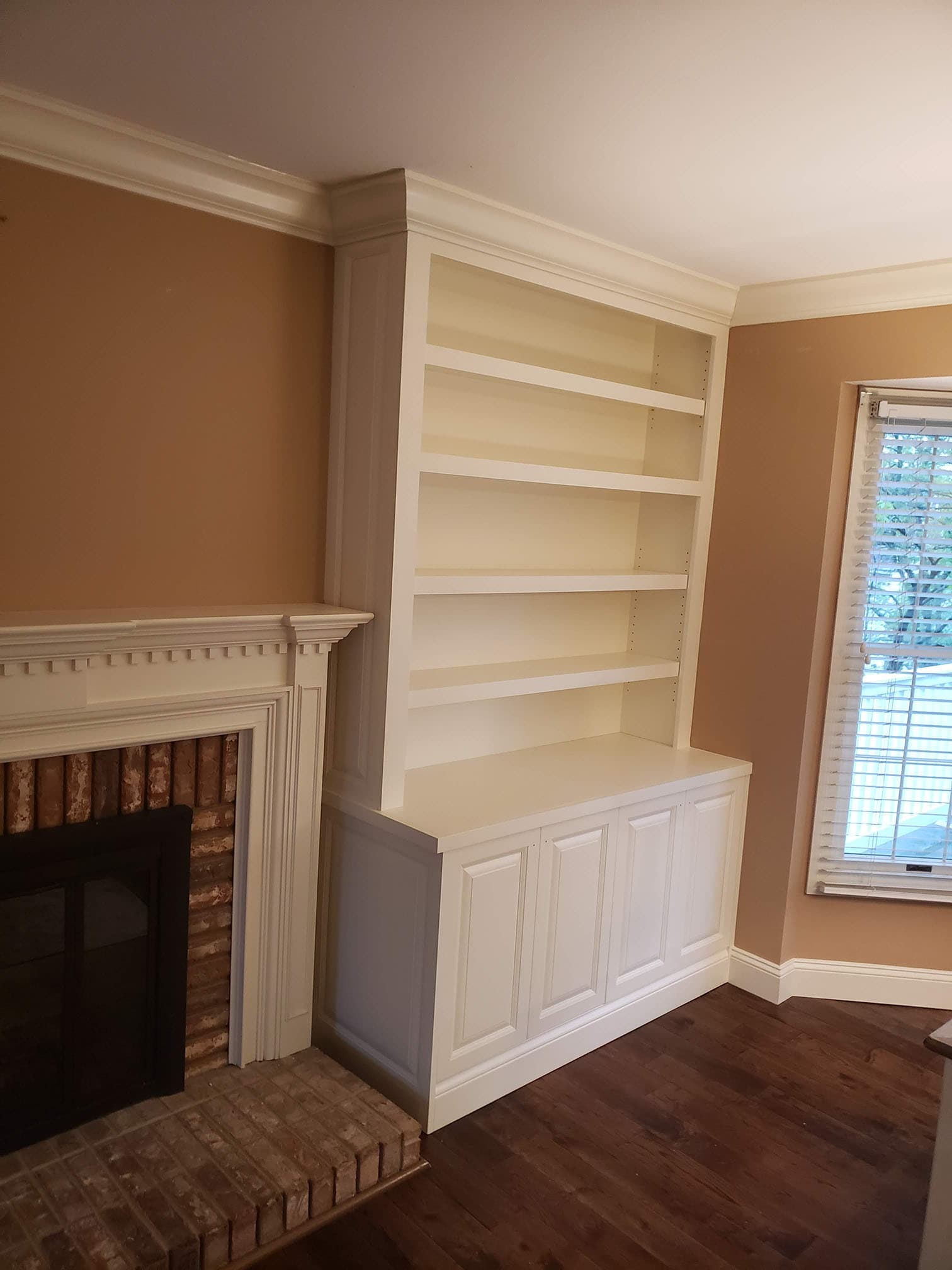 Custom entertainment center and media cabinet featuring entertainment fireplace remodel by Professional Wood Interiors - St. Louis, MO