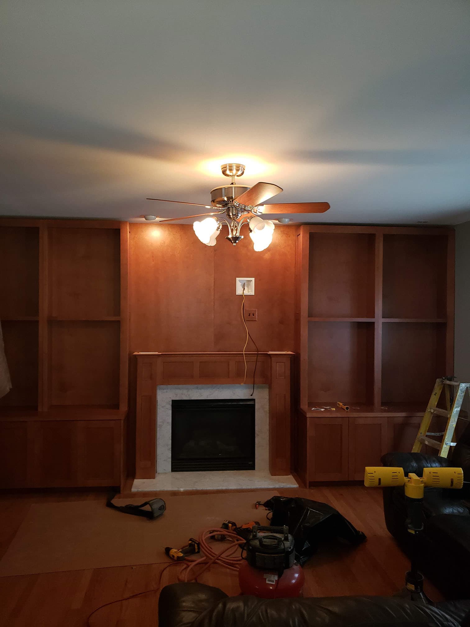 Floor-to-ceiling entertainment center with custom woodwork - Professional Wood Interiors - St. Louis, MO